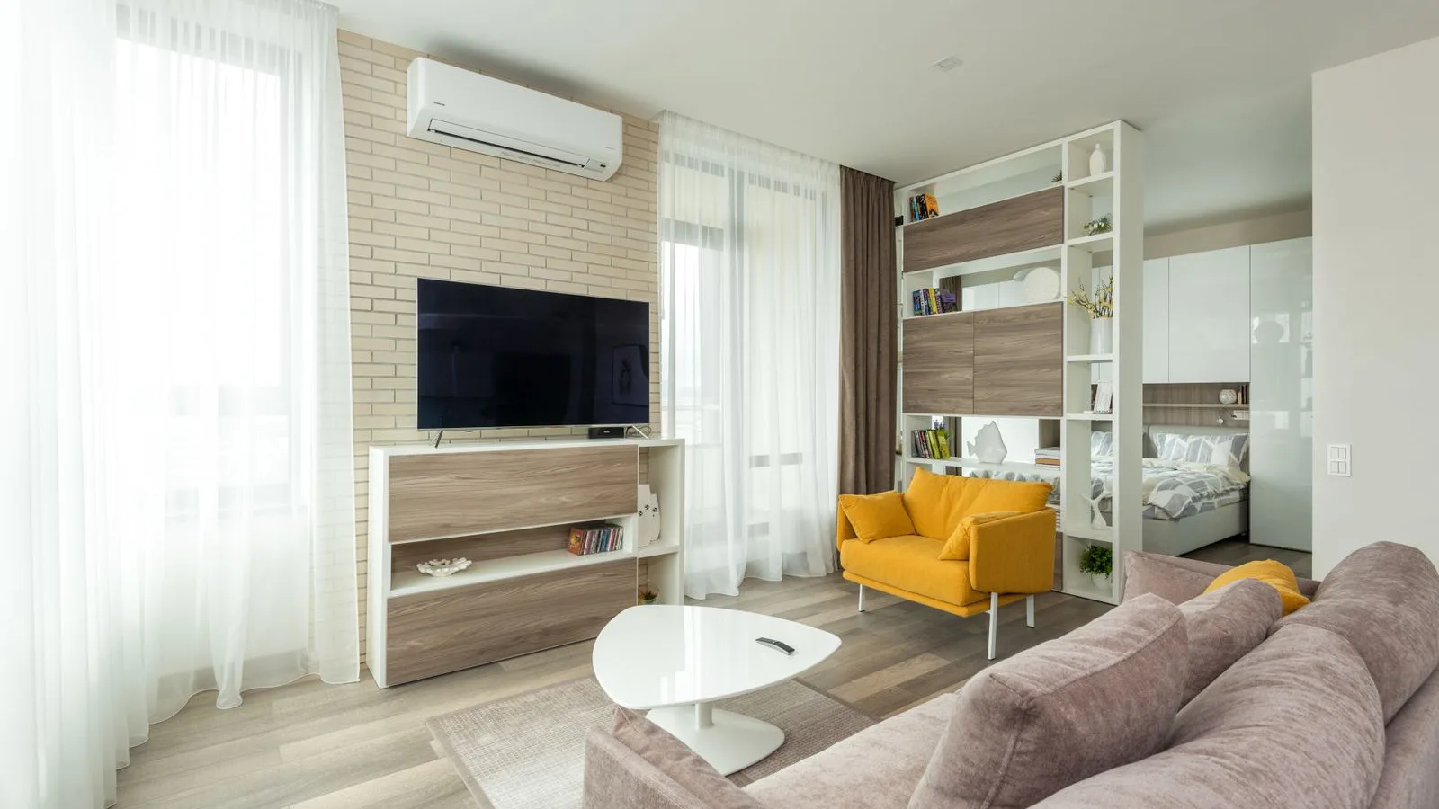 Wall-mounted DIY mini split indoor unit in a living room, the type installed with a precharged line set and no vacuum pump from MRCOOL DIY or Zone Air